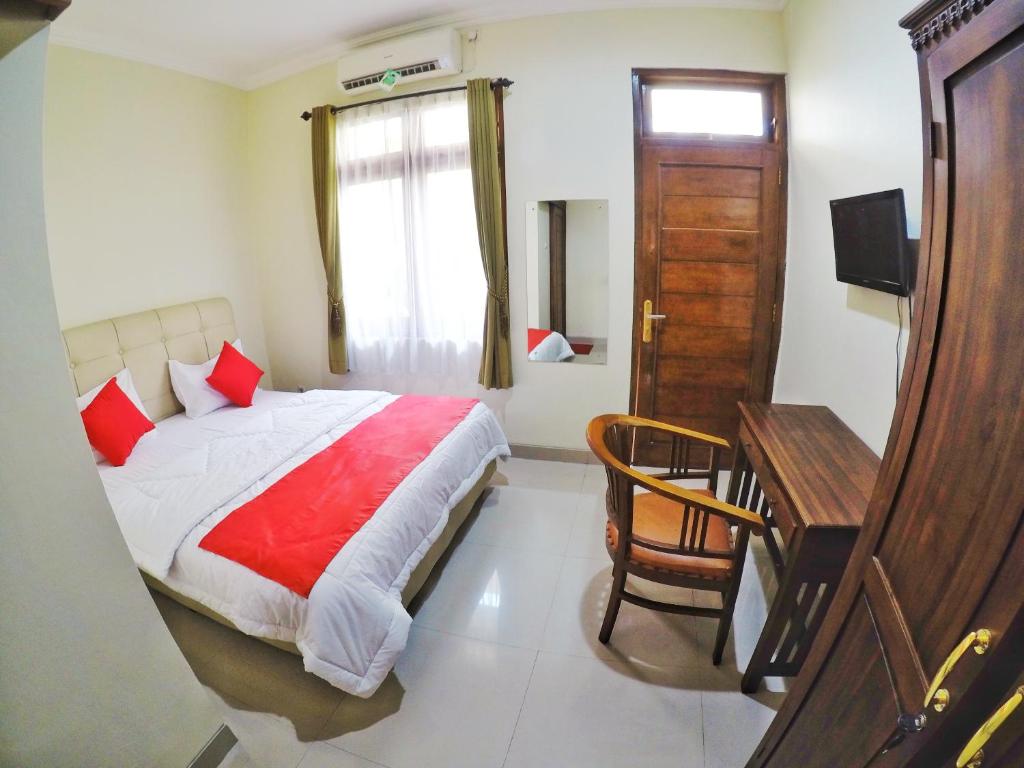 Postel nebo postele na pokoji v ubytování Griya Alsis Residence