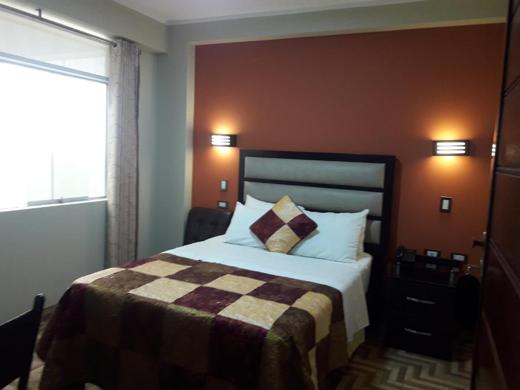 Postel nebo postele na pokoji v ubytování Gavina Inn Hotel