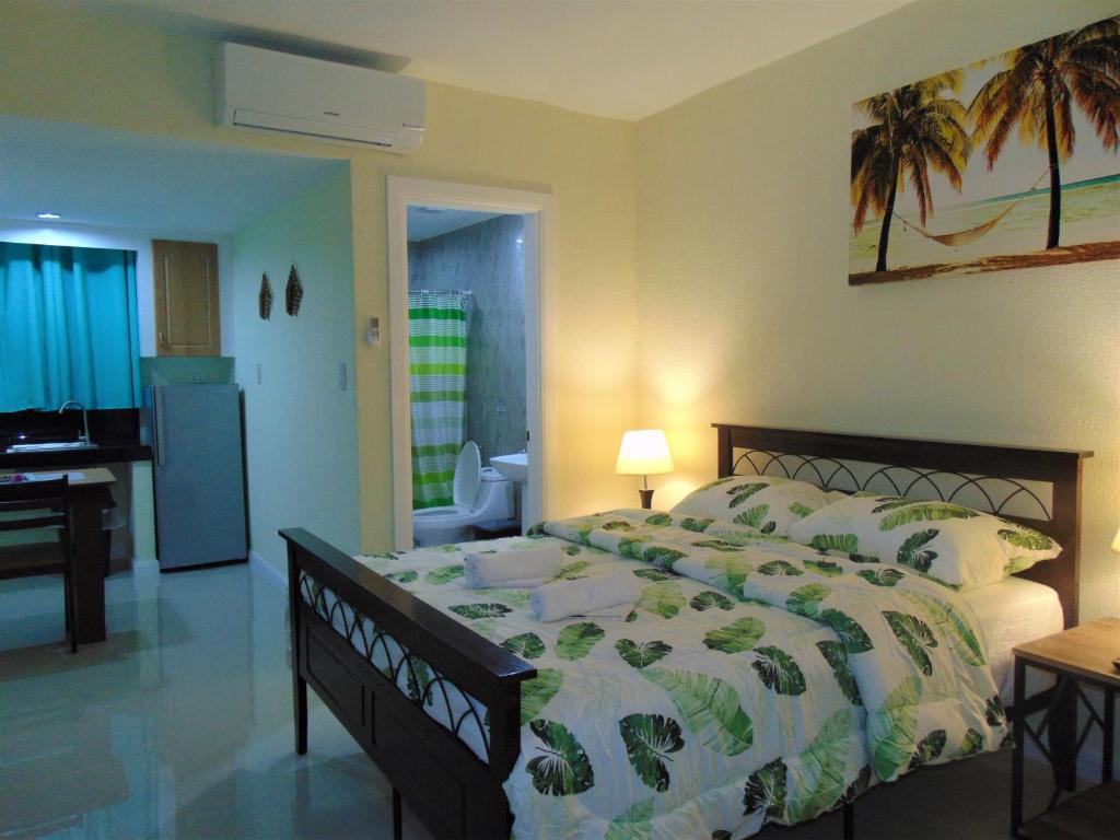 Postel nebo postele na pokoji v ubytování Coco Cabana Apartelle
