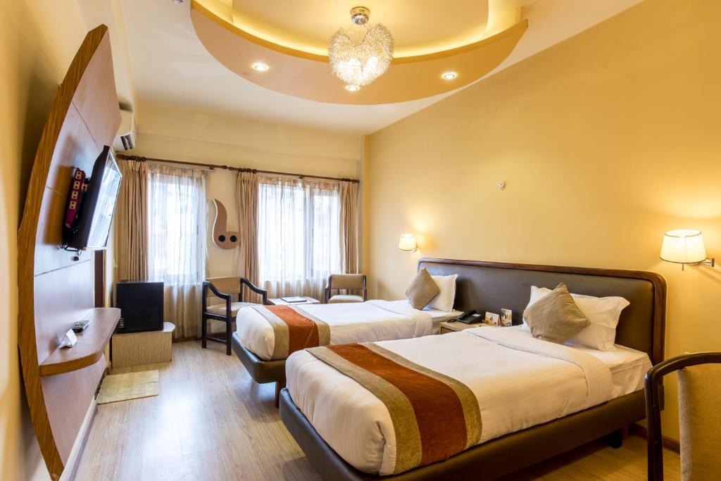 Postel nebo postele na pokoji v ubytování Hotel Moonlight