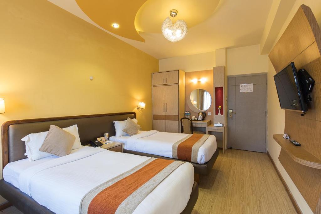 Postel nebo postele na pokoji v ubytování Hotel Moonlight