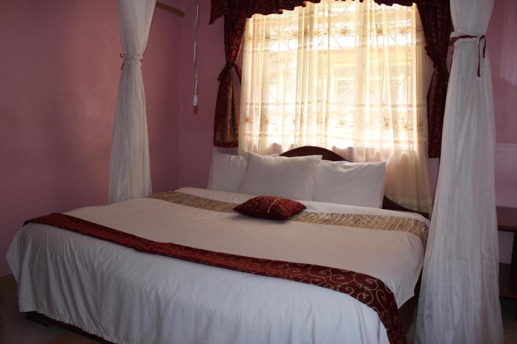Postel nebo postele na pokoji v ubytování Salient Guest House