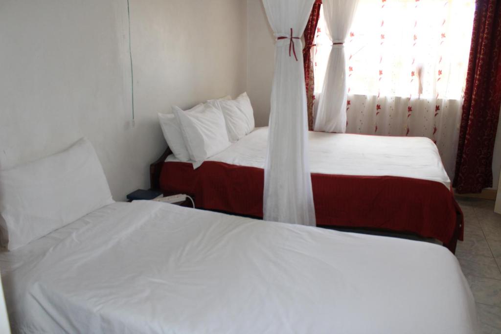 Postel nebo postele na pokoji v ubytování Salient Guest House