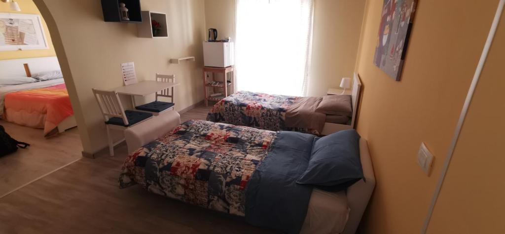 A bed or beds in a room at Il Pianoforte B&B
