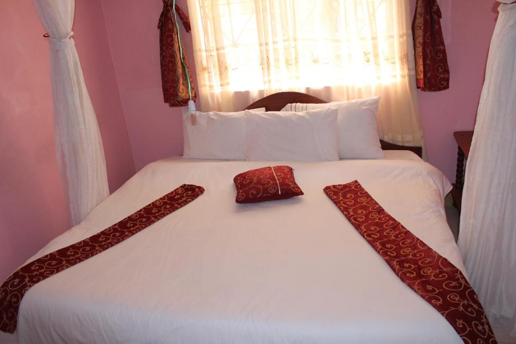 Postel nebo postele na pokoji v ubytování Salient Guest House