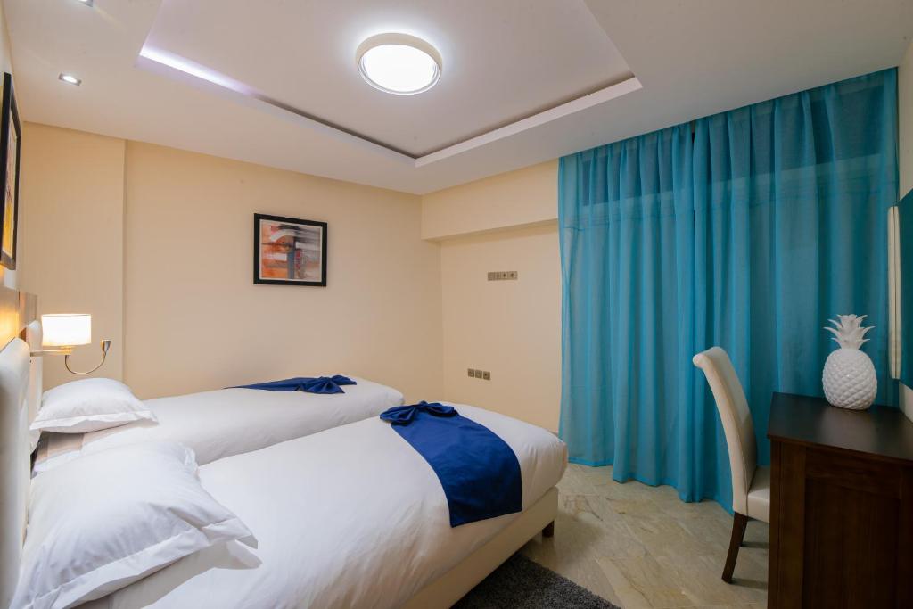 Postel nebo postele na pokoji v ubytování Appart-hotel Marrakech Inn