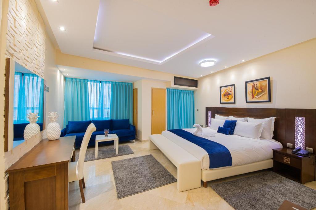 Postel nebo postele na pokoji v ubytování Appart-hotel Marrakech Inn