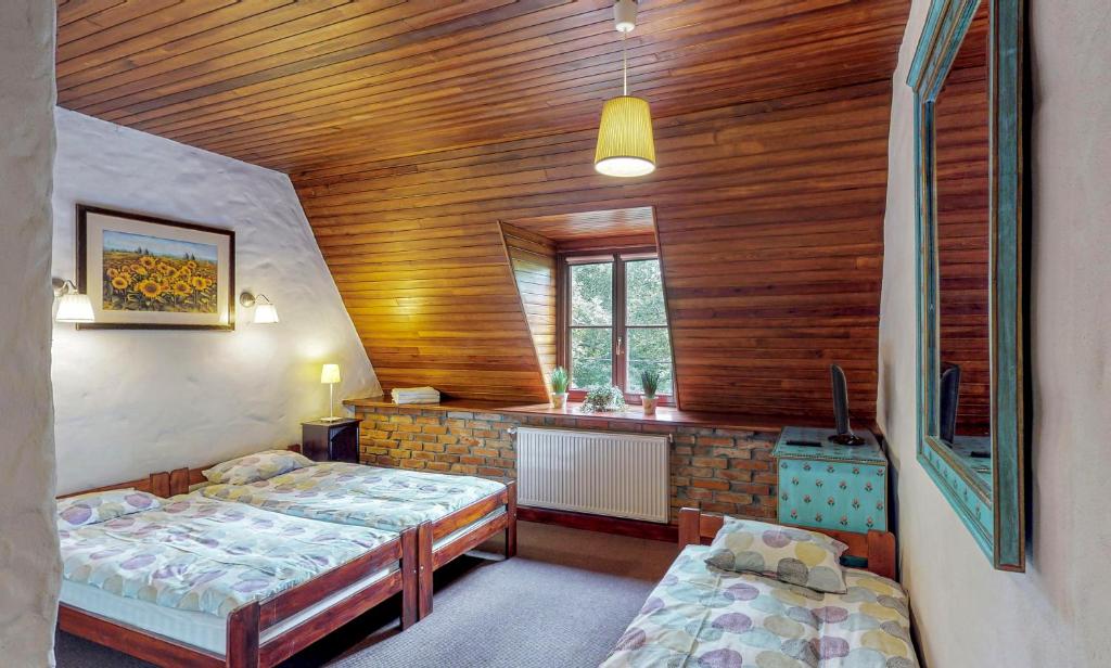 Posteľ alebo postele v izbe v ubytovaní Osada Ulnowo - Holliday & Party House