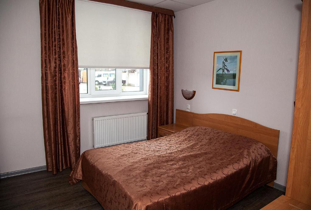 Cama o camas de una habitación en Kolos Hotel