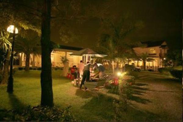 a group of people in a yard at night at Sheep House B&amp;B in Ji&#39;an