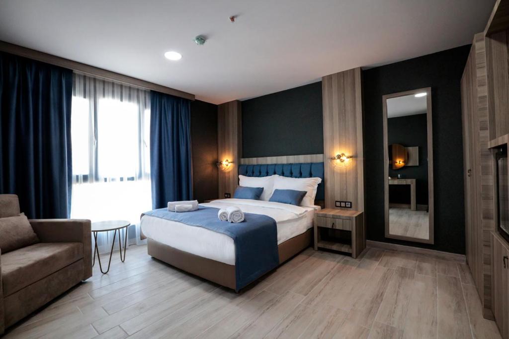 En eller flere senge i et værelse på CABA HOTEL &SPA