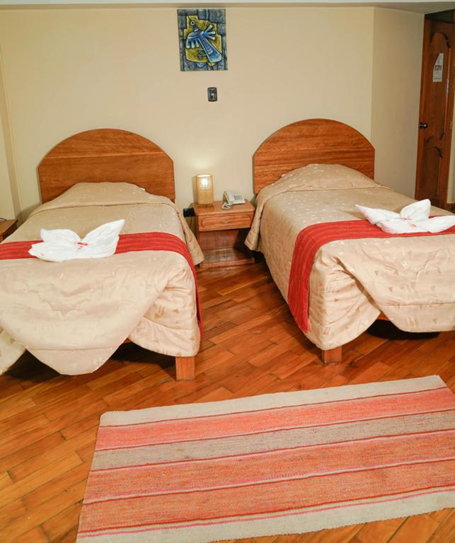 Postel nebo postele na pokoji v ubytování Hotel Melanys