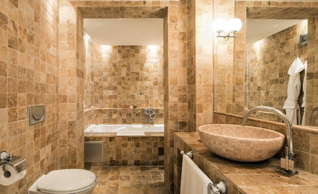 a bathroom with a sink and a toilet at Hotel Azimut in Sveti Stefan