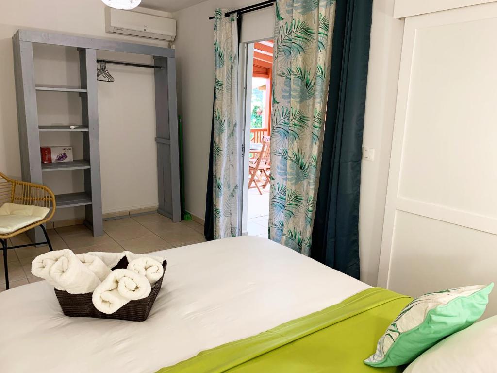 Postel nebo postele na pokoji v ubytování Le ZANDOLI (Appartement avec vue)