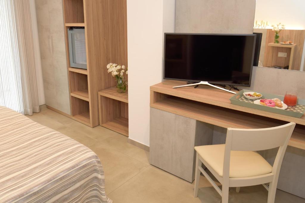 TV a/nebo společenská místnost v ubytování Hotel Abc