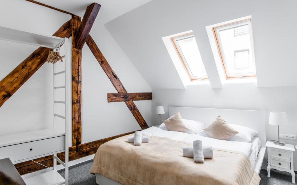A bed or beds in a room at Downtown Bratislava B&B