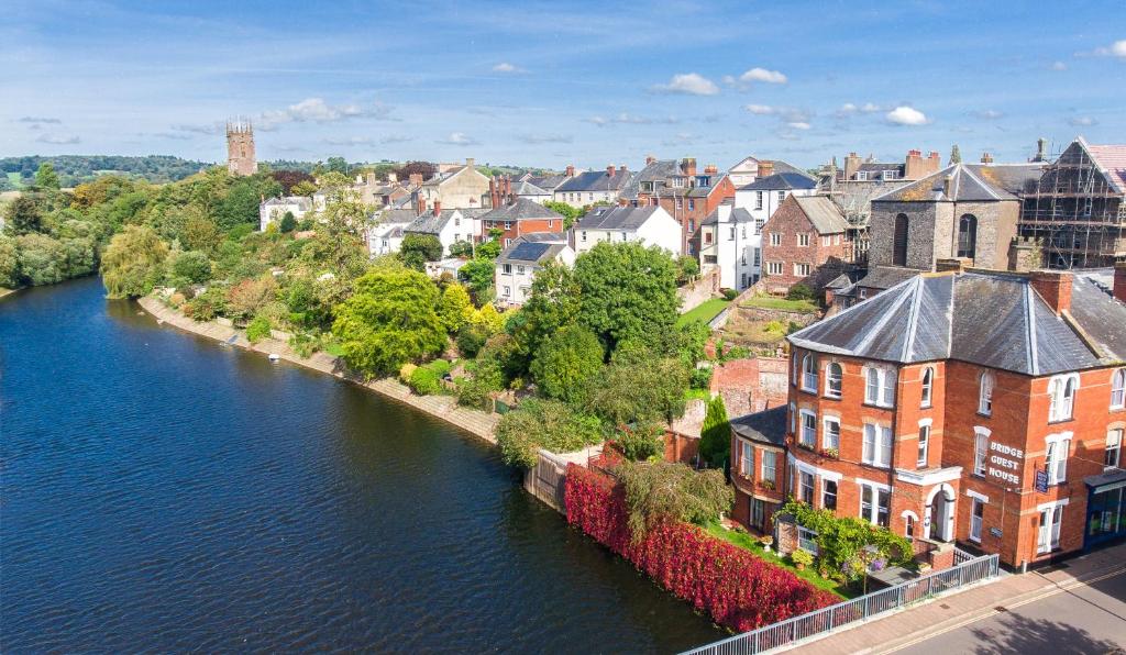 an aerial view of a town next to a river at Bridge Guest House in Tiverton