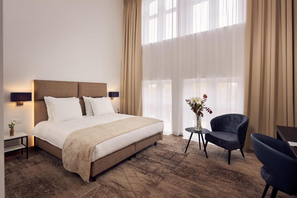 Postel nebo postele na pokoji v ubytování Van der Valk Hotel Mechelen