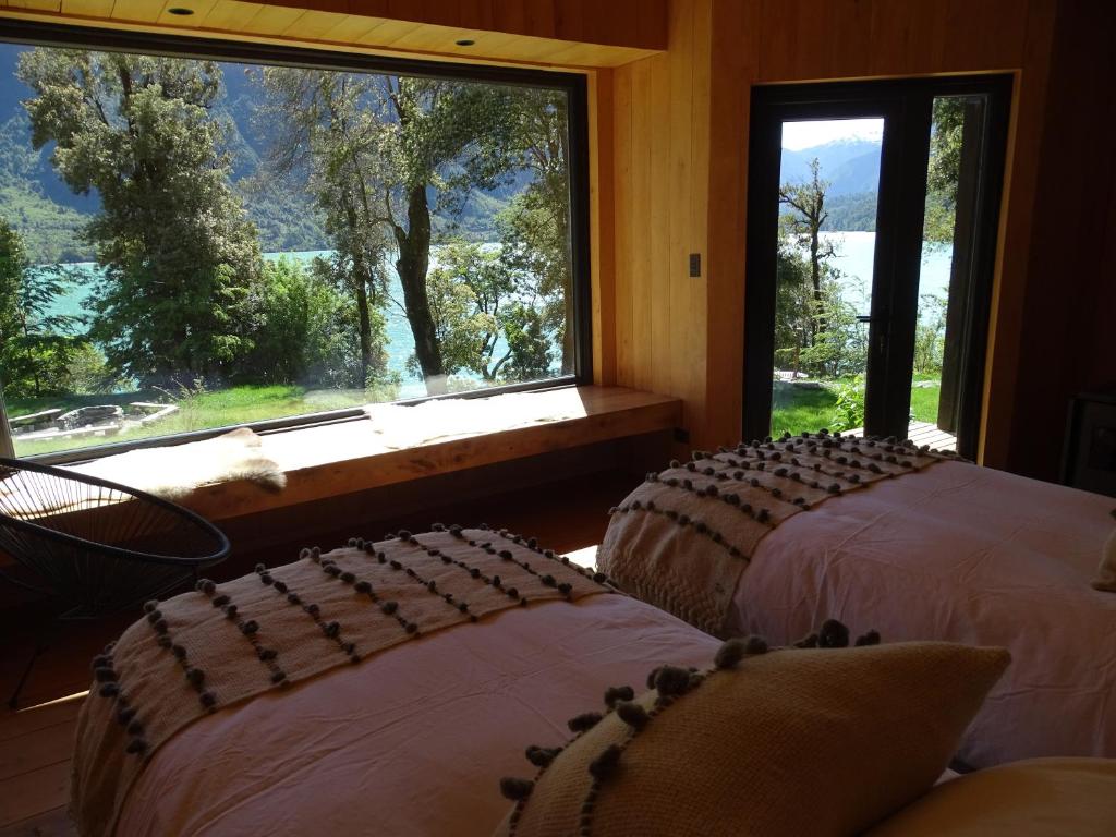 Postel nebo postele na pokoji v ubytování Lodge Tagua Tagua, Puelo Patagonia