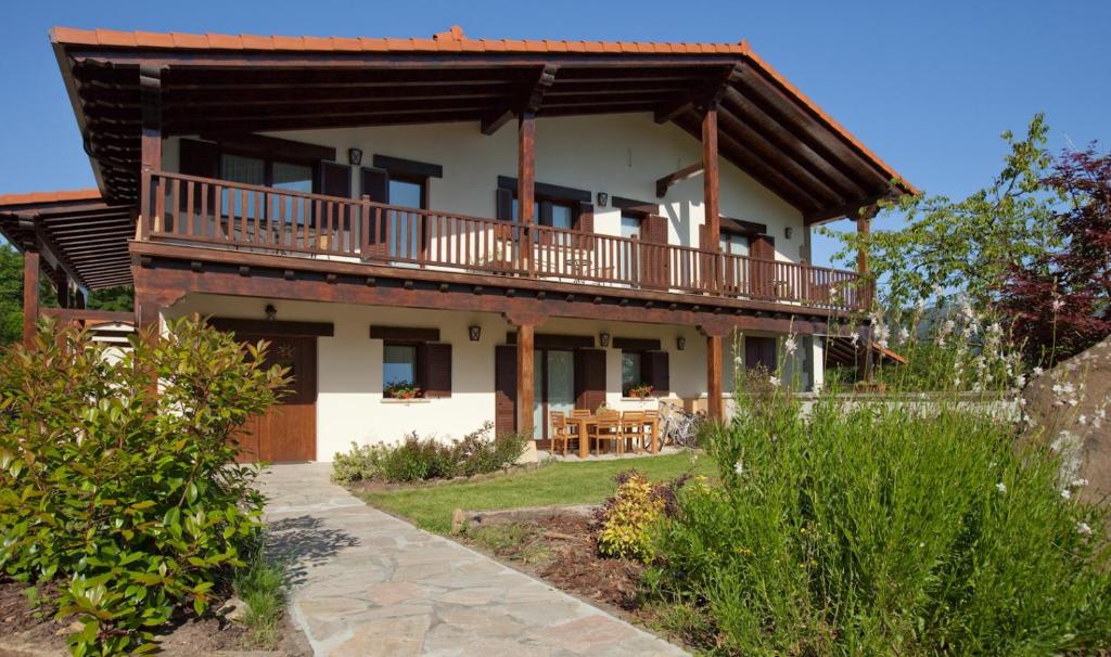 a large house with a balcony on top of it at OTXOENEA in Irún