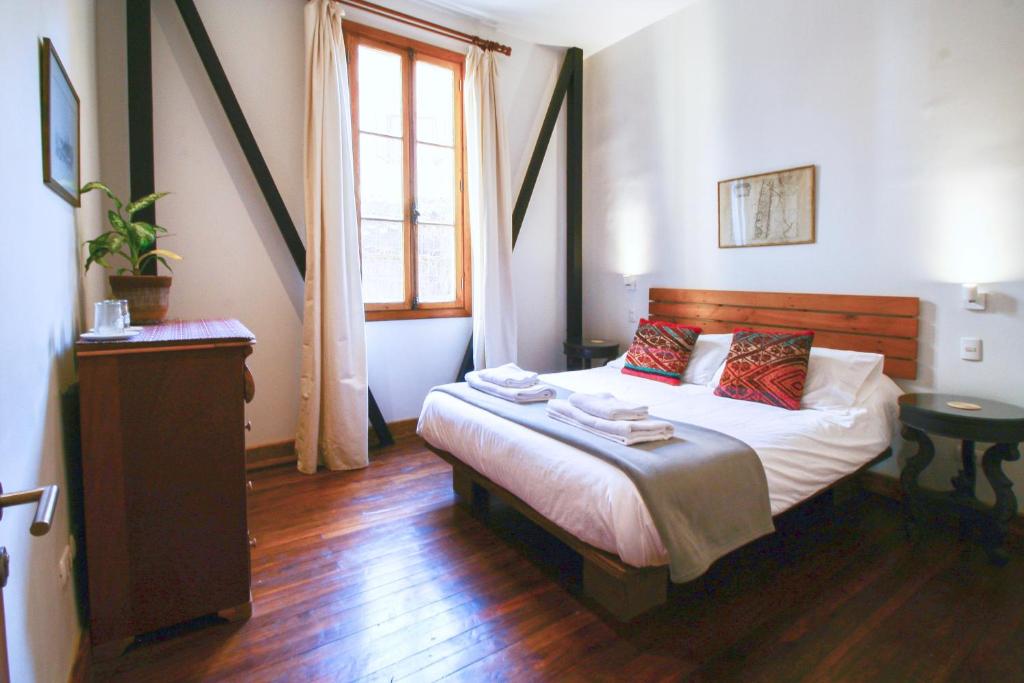 Postel nebo postele na pokoji v ubytování Casa California Guesthouse