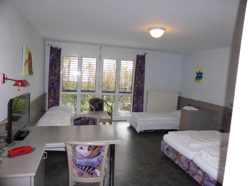 Postel nebo postele na pokoji v ubytování Gästehaus Linde, Hotel garni