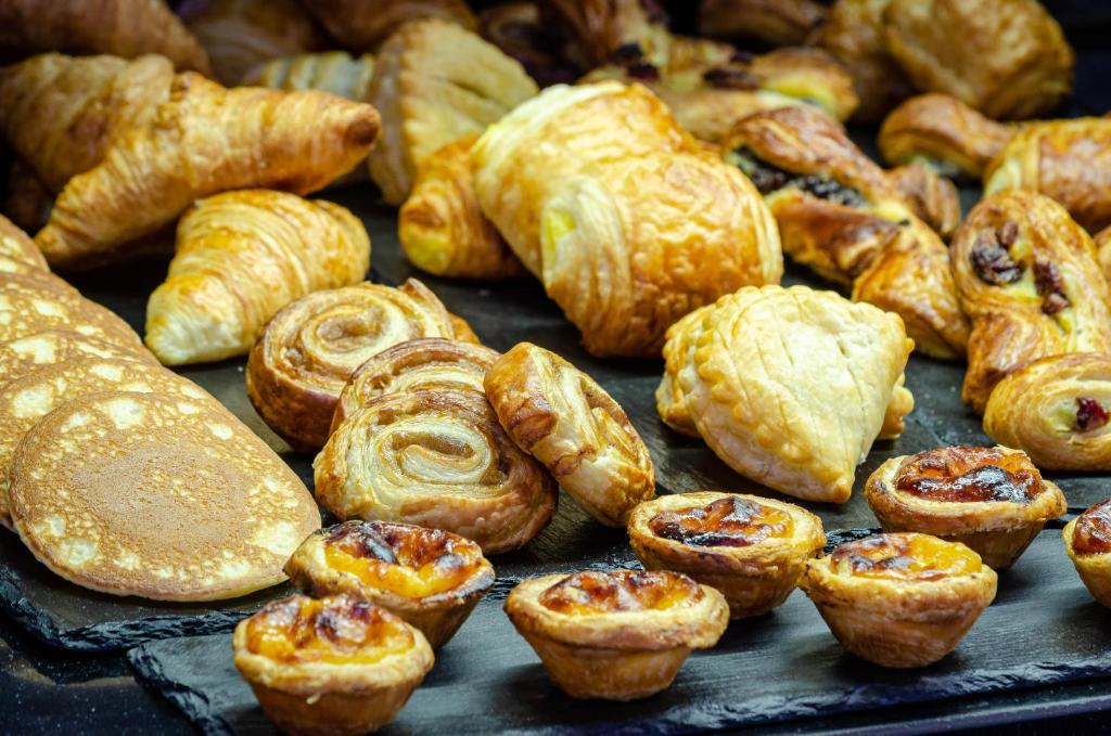 A tray of assorted pastries and croissants.