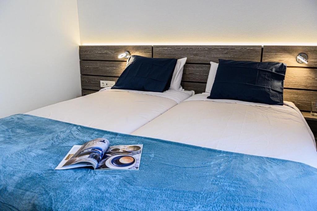 Postel nebo postele na pokoji v ubytování Lantia Rooftop House