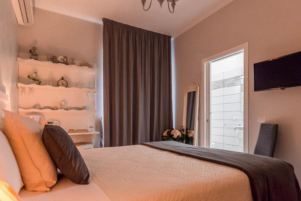 Posteľ alebo postele v izbe v ubytovaní A Casa di Titty