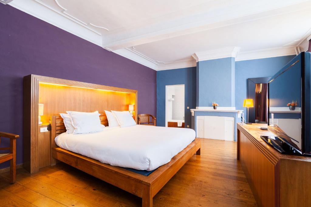 Postel nebo postele na pokoji v ubytování Hotel Hof van Aragon