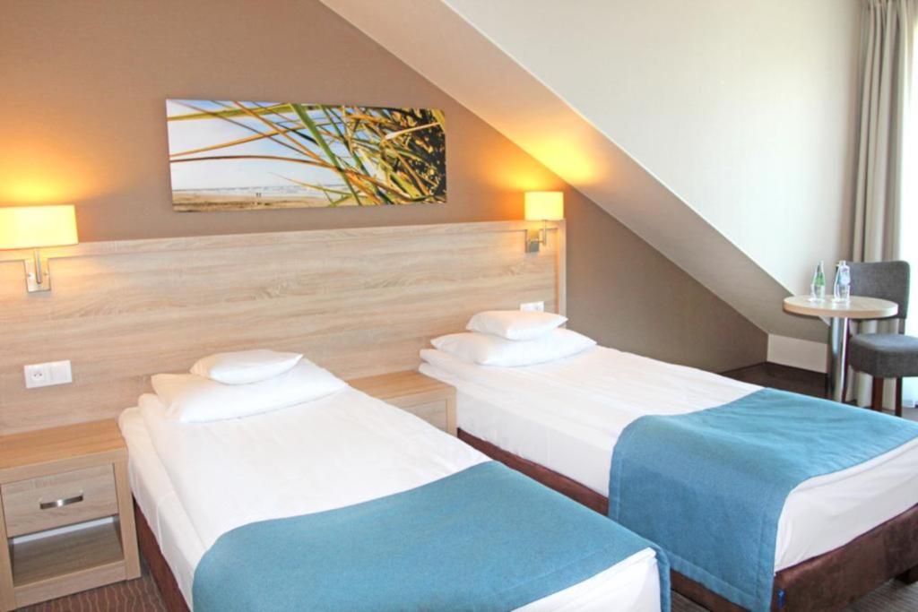 Postel nebo postele na pokoji v ubytování Tristan Hotel & SPA