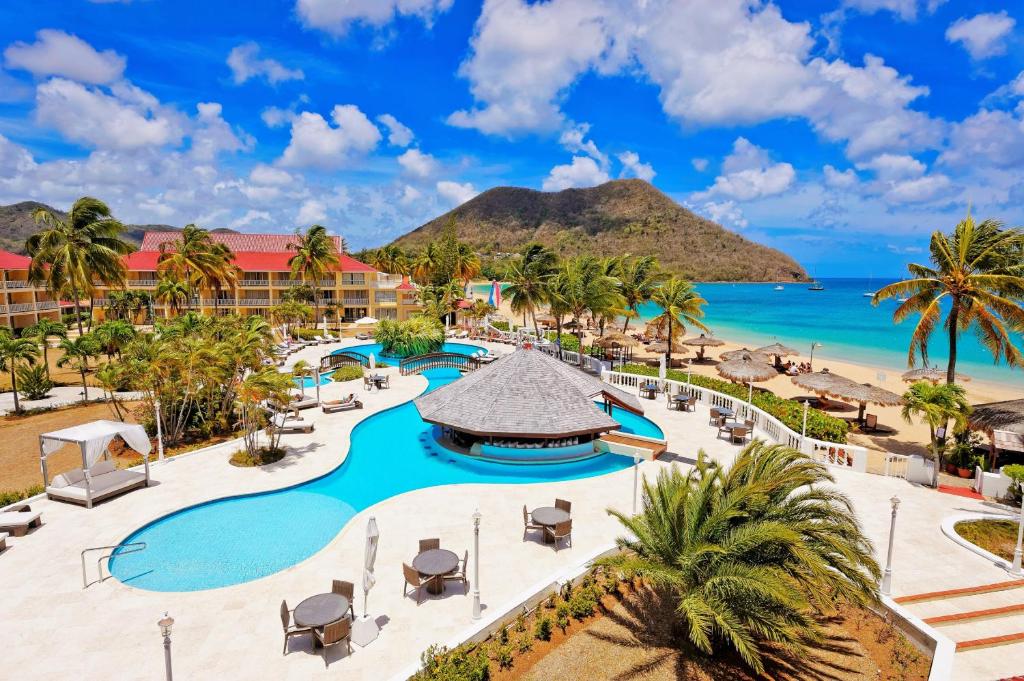ein Luftblick auf ein Resort mit Pool und Strand in der Unterkunft Mystique St Lucia by Royalton in Gros Islet