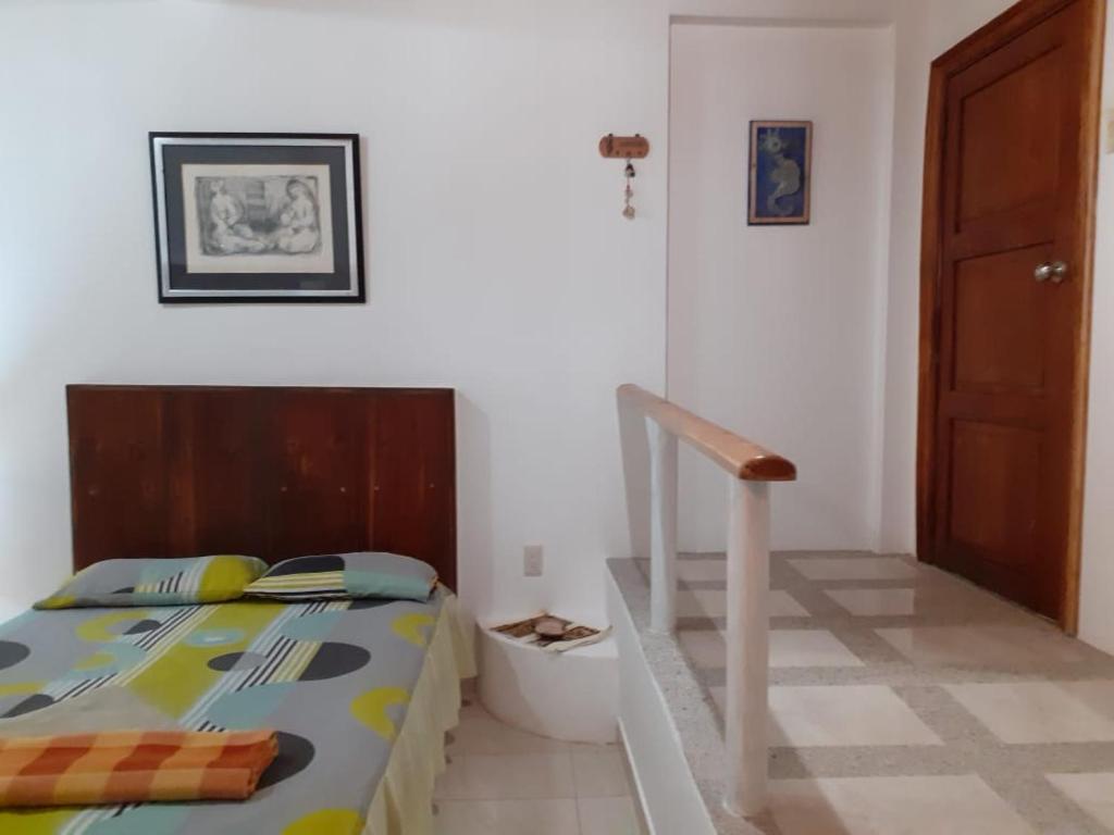 Postel nebo postele na pokoji v ubytování Hospedaje Algarrobo Machalilla