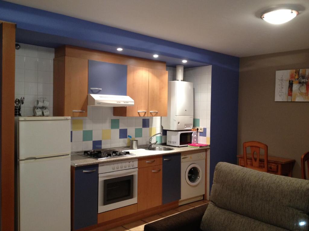 Kuchyň nebo kuchyňský kout v ubytování Apartamentos Residencial Fornocal