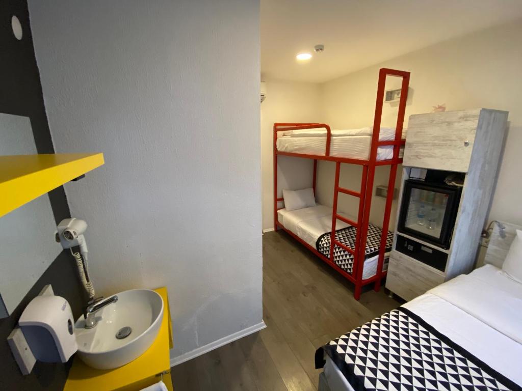 Postel nebo postele na pokoji v ubytování Piano Hotel