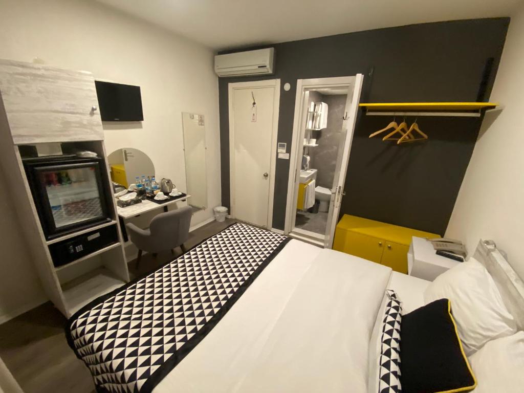 Postel nebo postele na pokoji v ubytování Piano Hotel