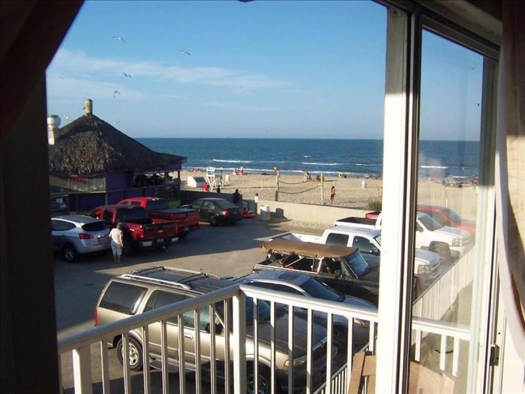 a view of a parking lot with a view of the beach at La Internacional Condos O211 in South Padre Island