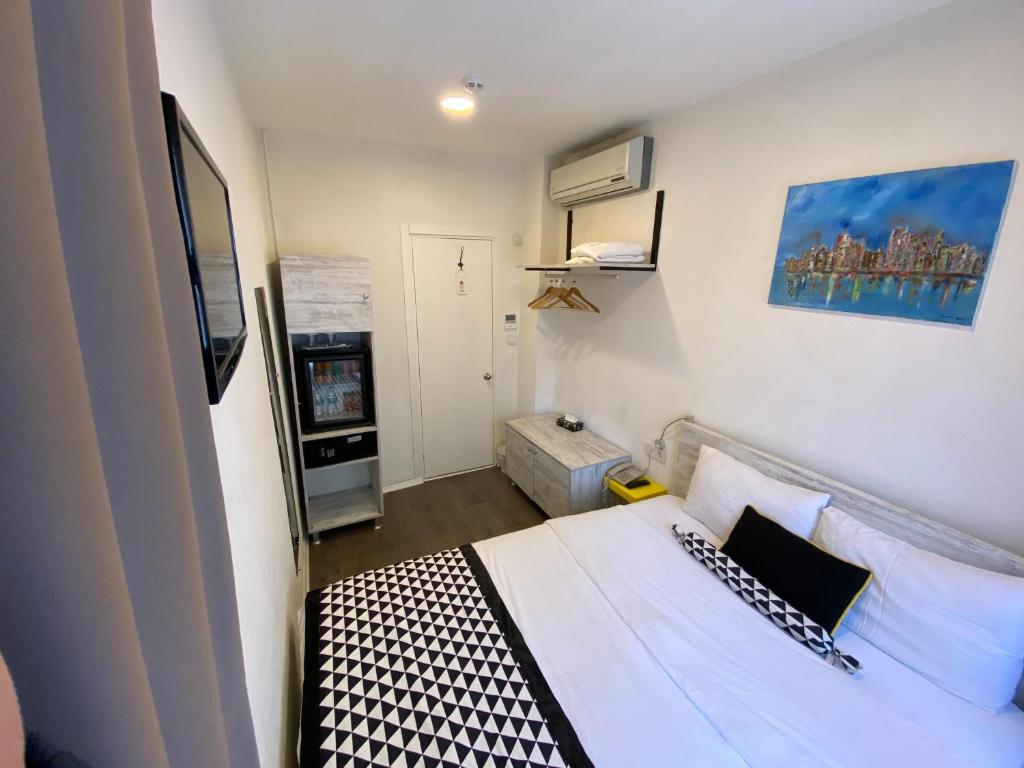 Postel nebo postele na pokoji v ubytování Piano Hotel