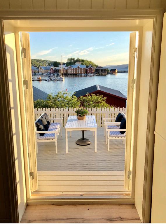 a view of a porch with a table and chairs at Pålberget in Råkvåg