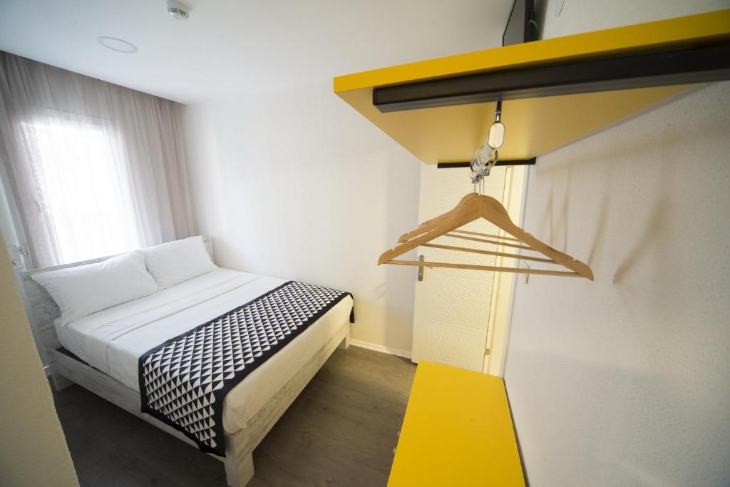 Postel nebo postele na pokoji v ubytování Piano Hotel