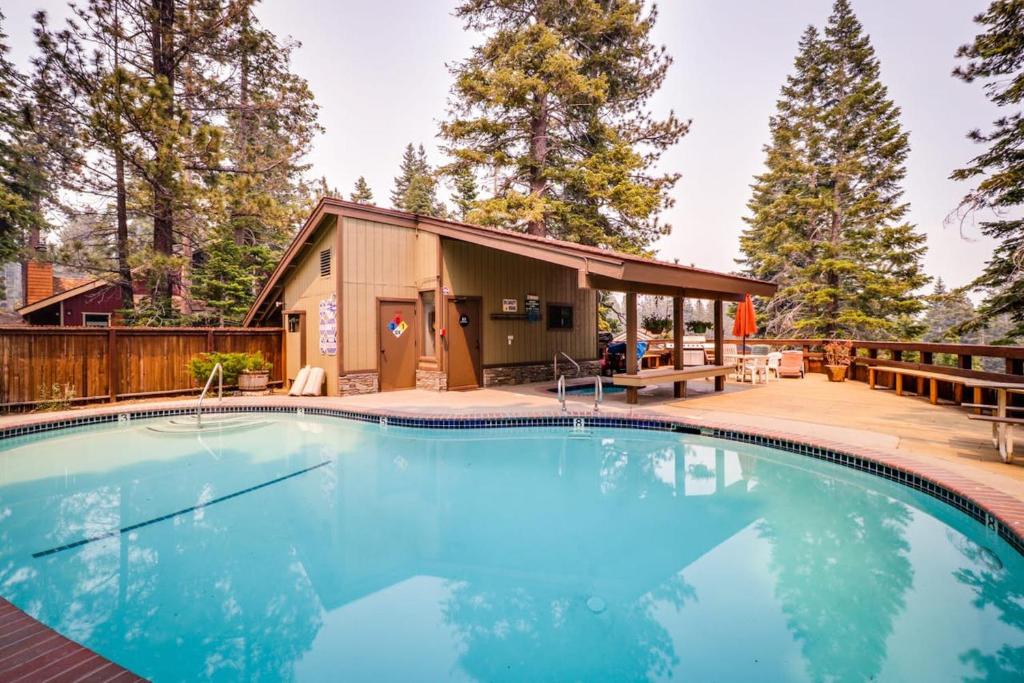 a swimming pool in front of a house at Hidden Valley Condominiums in Mammoth Lakes