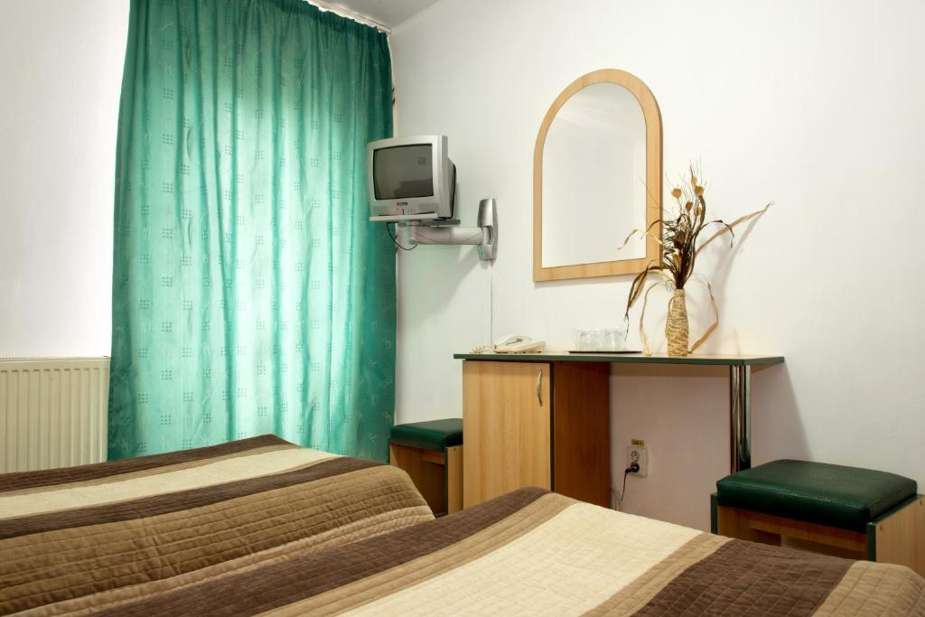 Postel nebo postele na pokoji v ubytování Hotel Beta