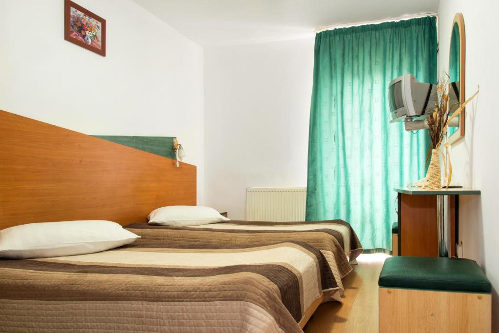Postel nebo postele na pokoji v ubytování Hotel Beta