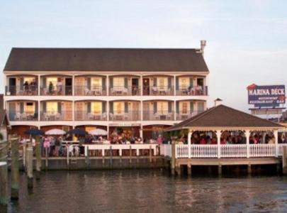 a large building with a restaurant on the water at Talbot Inn in Ocean City