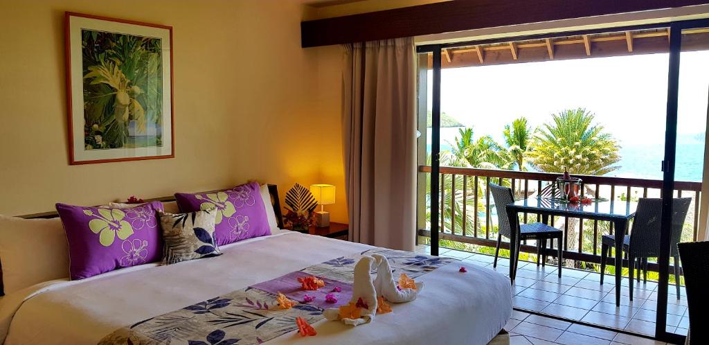 Uma cama ou camas num quarto em Maitai Bora Bora