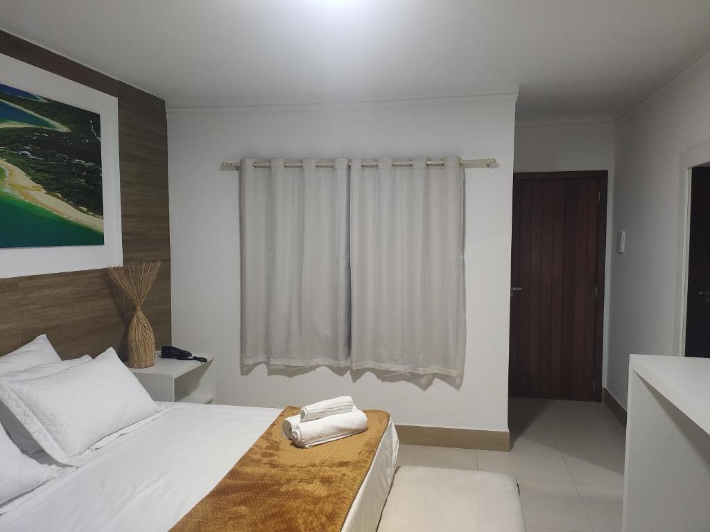 Uma cama ou camas num quarto em Arraial do Sol Beach Hotel