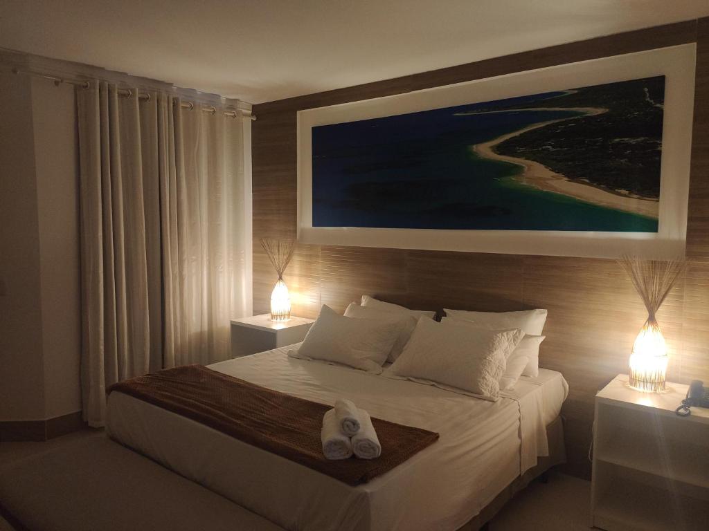 Uma cama ou camas num quarto em Arraial do Sol Beach Hotel