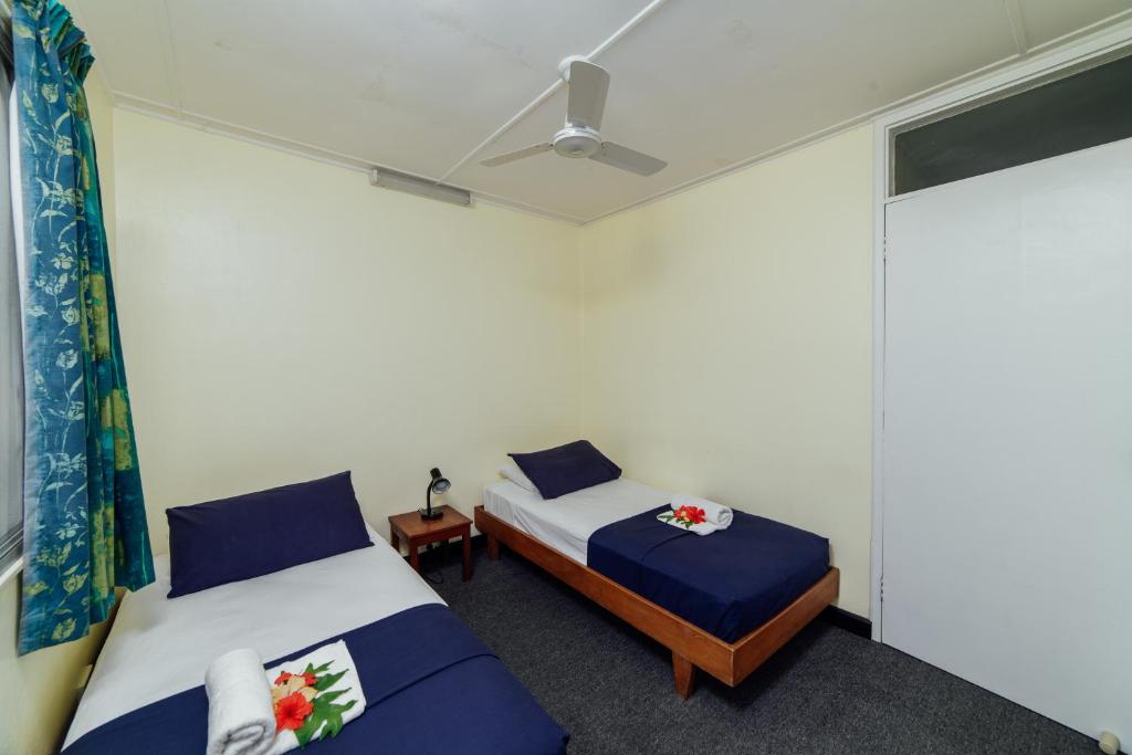 Postel nebo postele na pokoji v ubytování Kaiviti Motel