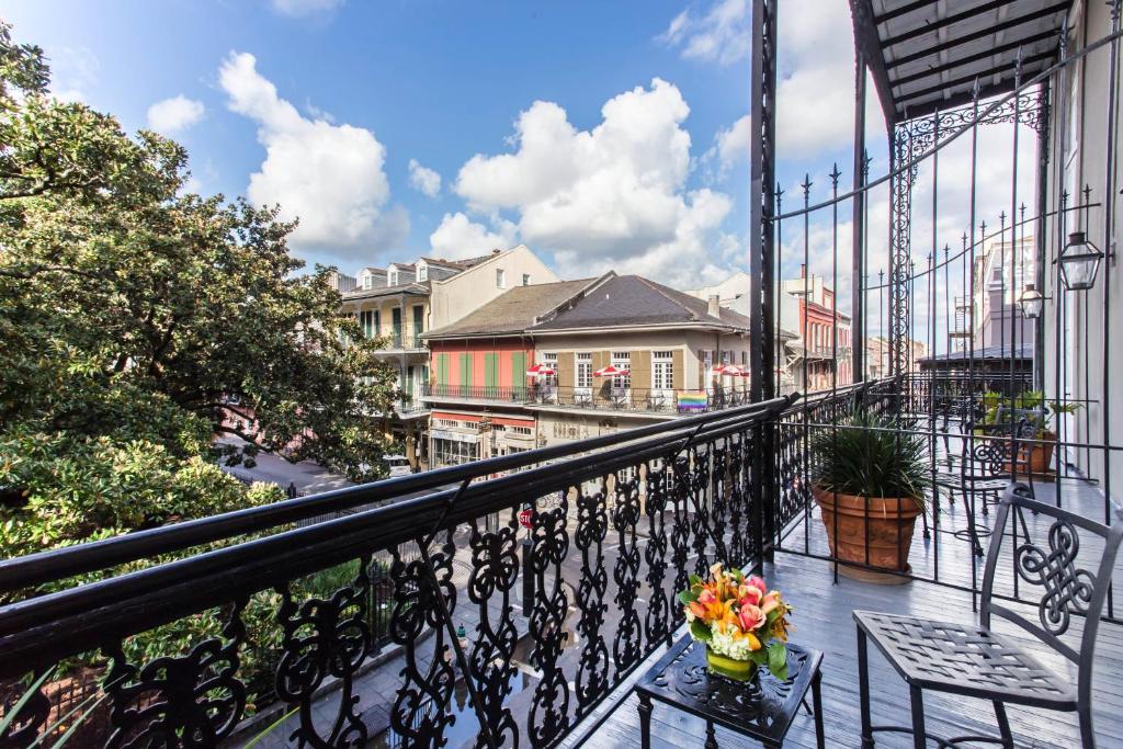 a balcony with a table with flowers on it at Omni Royal Orleans Hotel in New Orleans