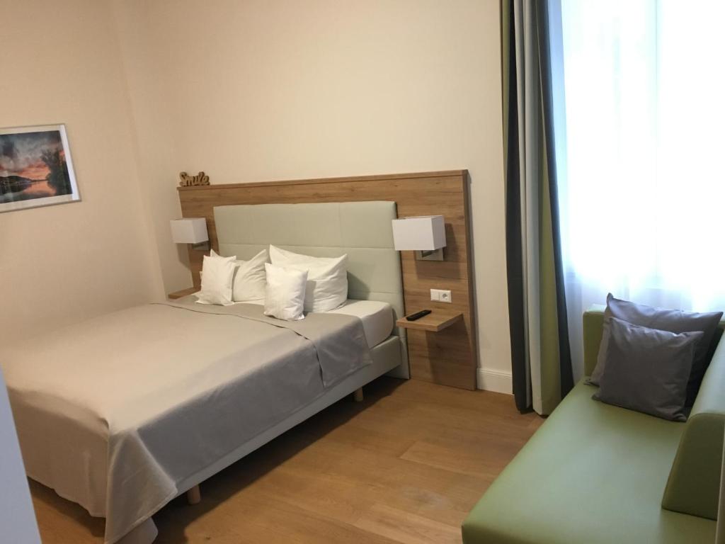 Postel nebo postele na pokoji v ubytování Perkeo Apartments
